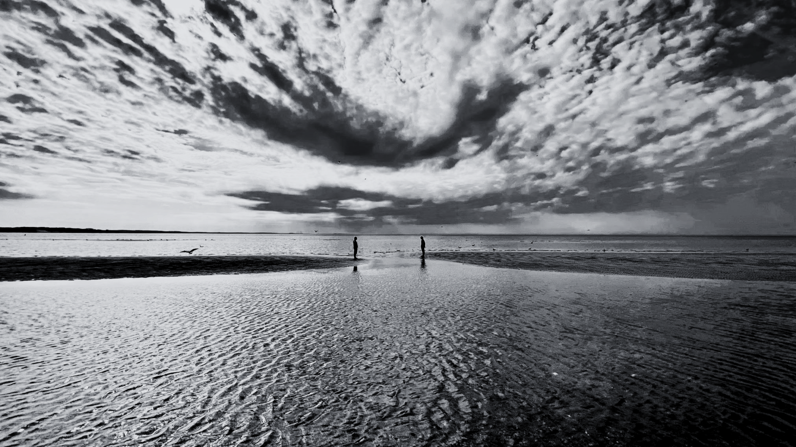 Photograph of two distanced people by Tina Xing